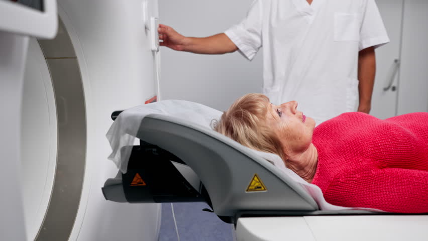 in a modern clinic in a white office, a drug for MRI examination of the brain of an elderly woman young doctor nearby