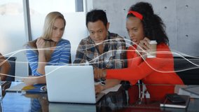 Data wave animation over diverse colleagues collaborating on laptop in office. Collaboration, teamwork, technology, innovation, diversity, business - Powered by Shutterstock - Get 15% off with code: PIKWIZARD15