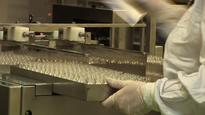 Automated production of medicines. Installation of glass containers on a