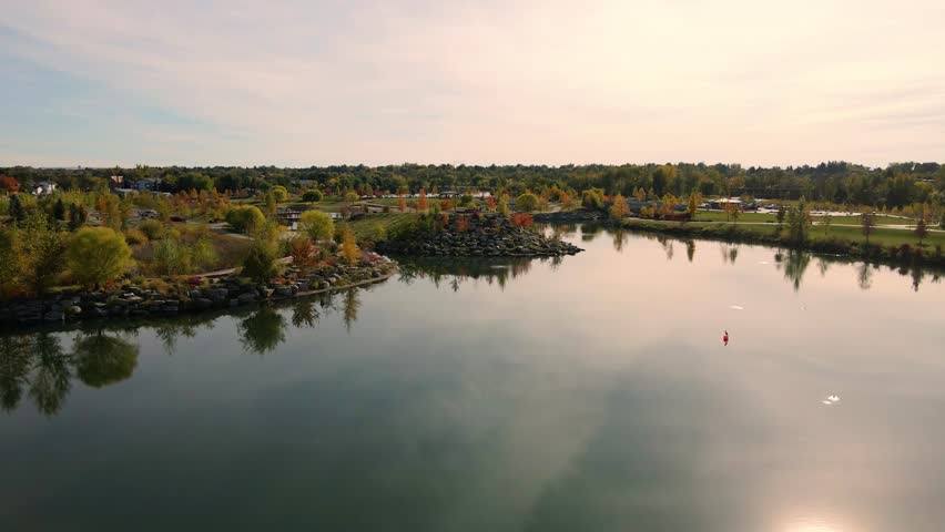 Fall time leaves and trees during a sunset over Quinns Pond in Boise Idaho.