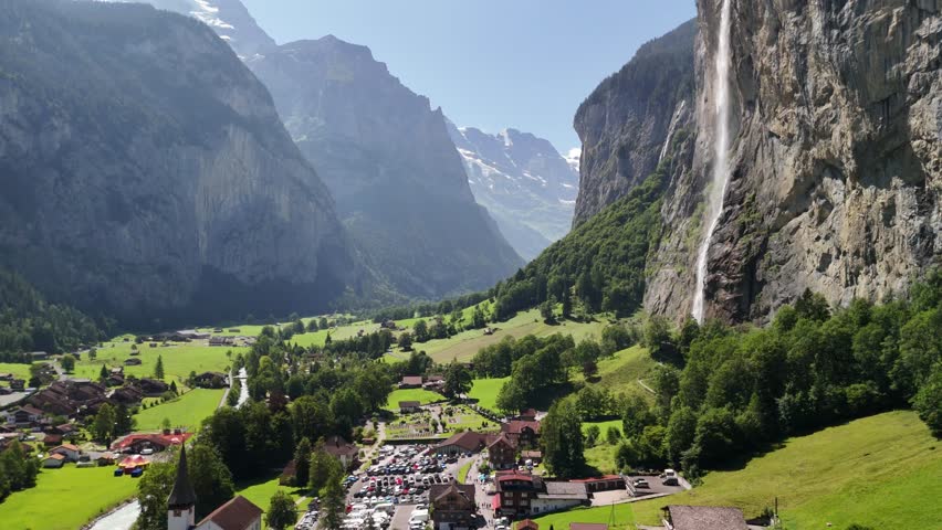 Village Swiss Alps mountains waterfall, Lauterbrunnen houses, Switzerland