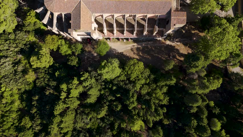 Top-down aerial shot overhead a French Abbey with beautiful gardens