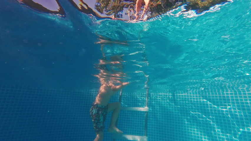 Happy Little Boy Jumping Pool Blue Clear Water. Summer Swim, Underwater Leisure