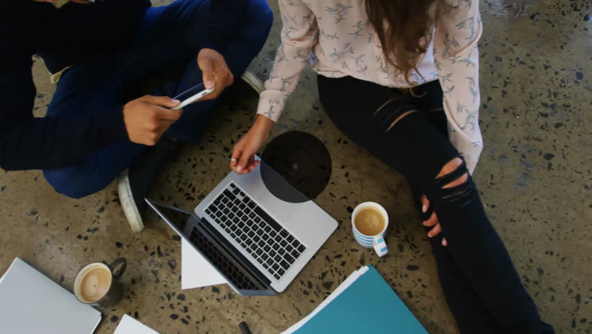 Using laptop and tablet, people connected with media icons animation above them. Technology, communication, digital, internet, social media, devices