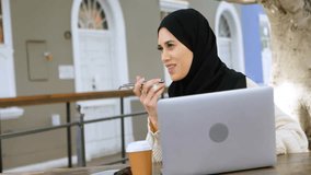 Shopping and security icons animation over woman using laptop and smartphone. E-commerce, online shopping, cybersecurity, internet, digital, technology - Powered by Shutterstock - Get 15% off with code: PIKWIZARD15