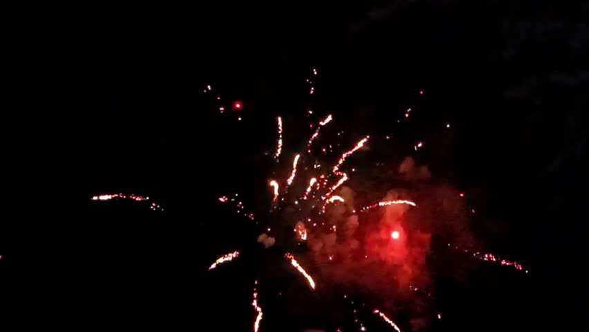 Sparkling colorful fireworks in the dark night sky