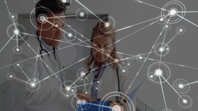 Discussing medical records, doctors with network connections and data processing animation. Healthcare, technology, digital, professionals, consultation - Powered by Shutterstock - Get 15% off with code: PIKWIZARD15