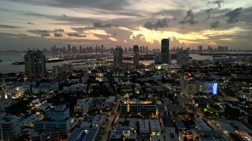 Miami Beach, South Beach. Miami Beach night skyline. Miami cityscape, aerial view. Top view of Miami coastline, shore at night, waterfront near ocean. Luxury travel in USA.