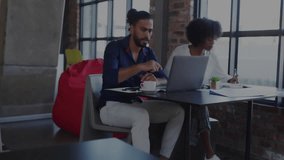 Encrypted data transfer animation over two people discussing work at laptop. Technology, business, communication, cybersecurity, encryption, collaboration - Powered by Shutterstock - Get 15% off with code: PIKWIZARD15