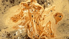 Super Slow Motion of Mixing Coffee with Foam in Detail. Filmed on High Speed Cinema Camera, 1000fps. Top Down Composition.  - Powered by Shutterstock - Get 15% off with code: PIKWIZARD15