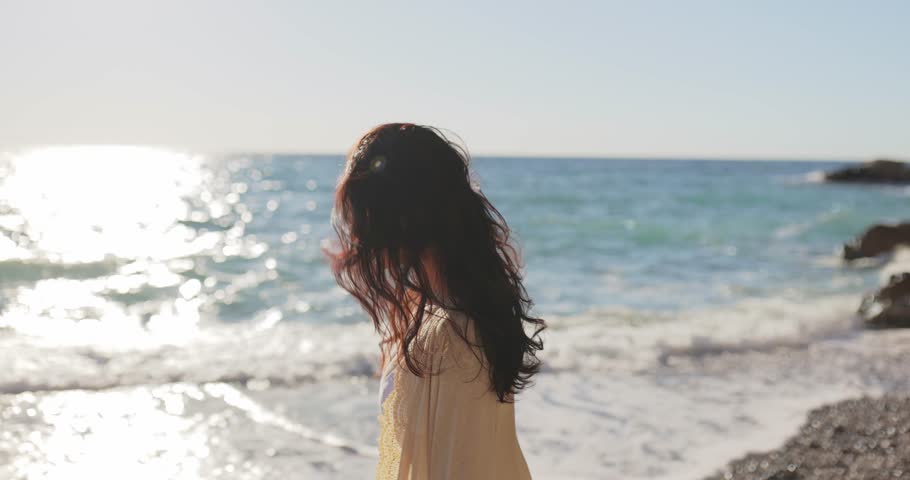 Slow-motion footage of a woman walking along a sunlit beach in Antalya, Turkey. The peaceful ocean waves and serene atmosphere make this clip perfect for travel, relaxation, and lifestyle concepts.