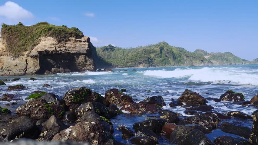 beach with rocks and hills landscape view, nature landscape