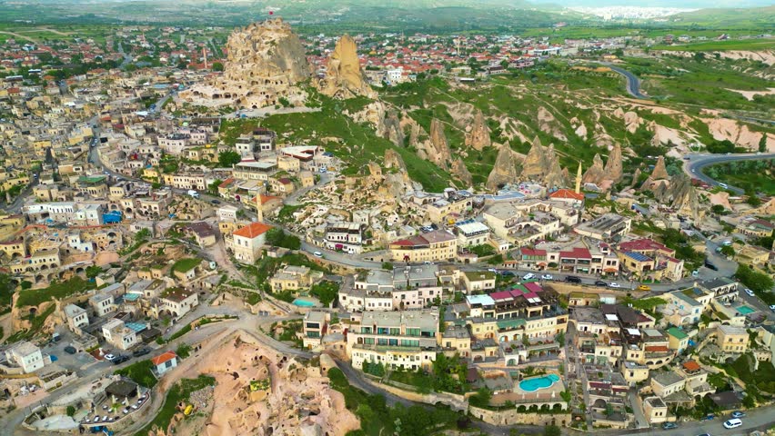 Aerial 4k top view of Uçhisar Castle rock in Cappadocia Turkey
