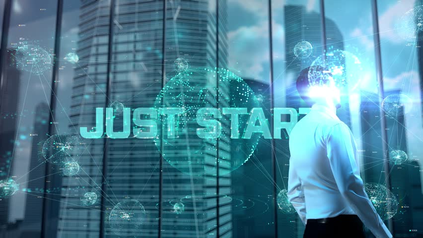 just start. Businessman Working in Office among Skyscrapers. Hologram Concept