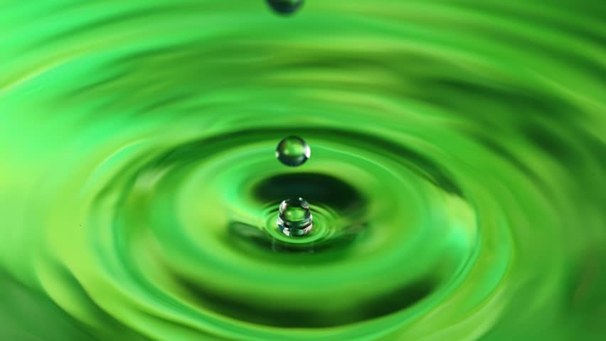Slow motion of splashing water drop on green screen background , filmed on high speed cinematic camera at 1000 FPS