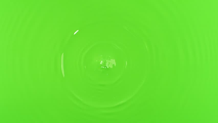 Slow motion of splashing water drop on green screen background , filmed on high speed cinematic camera at 1000 FPS