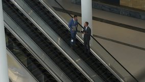 Business people on escalator with network connections and data processing animation. technology, digital, networking, communication, innovation, corporate - Powered by Shutterstock - Get 15% off with code: PIKWIZARD15