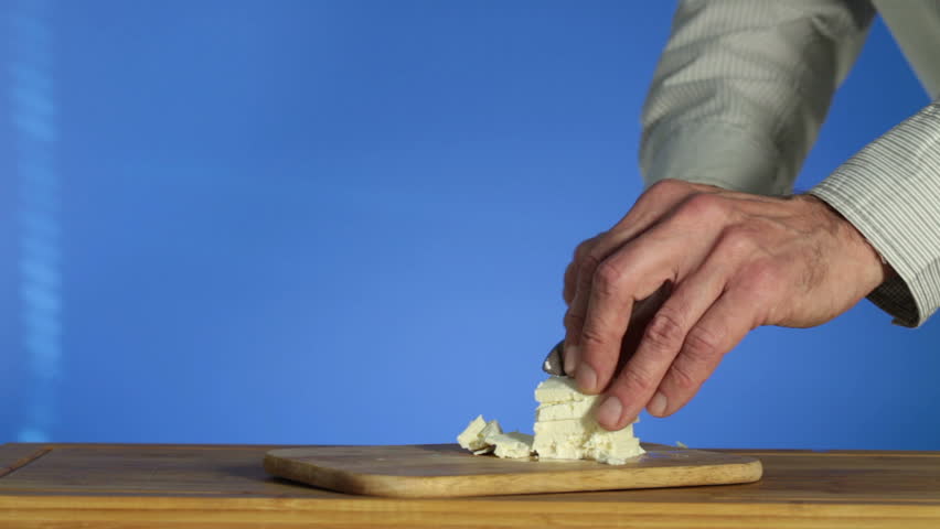 Cheese cut with a knife for the salad
