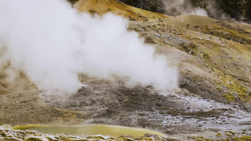 Cinematic shot of thermal steam vent in Yellowstone National Park, USA