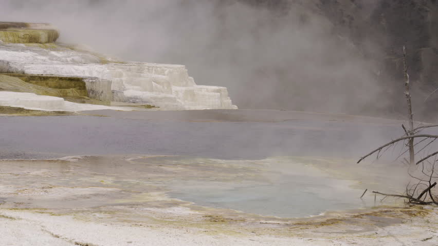 Cinematic shot of thermal mineral terrace at Mammoth Hot Spring in Yellowstone National Park, USA