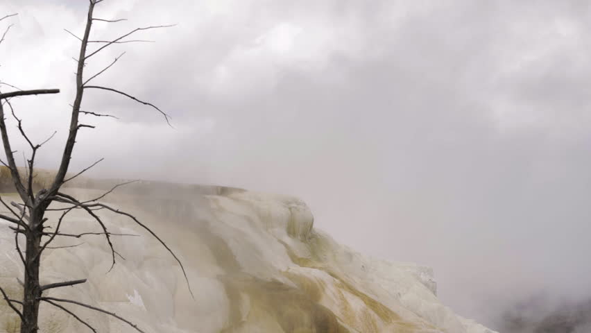 Cinematic shot of thermal mineral terrace at Mammoth Hot Spring in Yellowstone National Park, USA