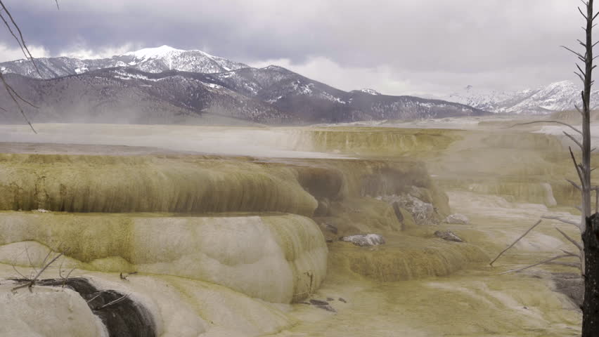 Cinematic shot of thermal mineral terrace at Mammoth Hot Spring in Yellowstone National Park, USA