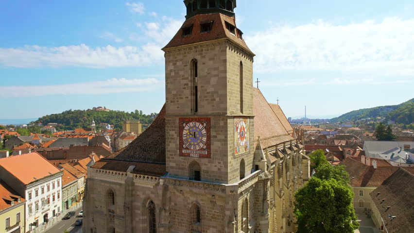 Aerial drone view of Brasov, Romania. Old city centre with Museum of History, Black church, buildings, people