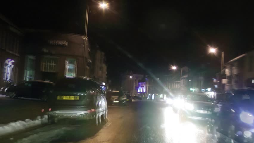 Driving a Car through streets at night