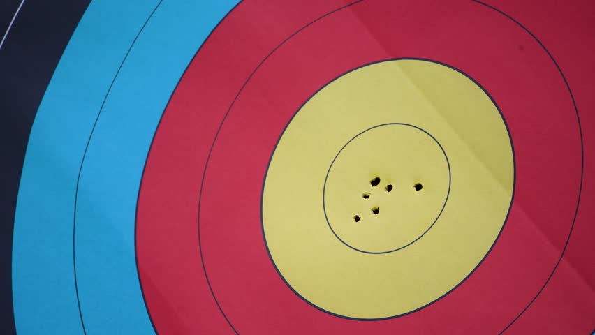 Close up arrows hit target center with archery sport precision