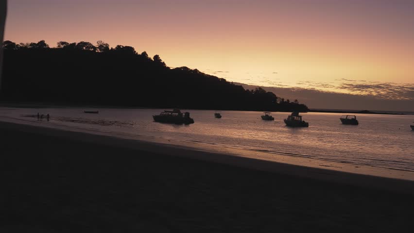 Sky after sunset and boats on the shallows on Nosy Be, Madagascar, Africa