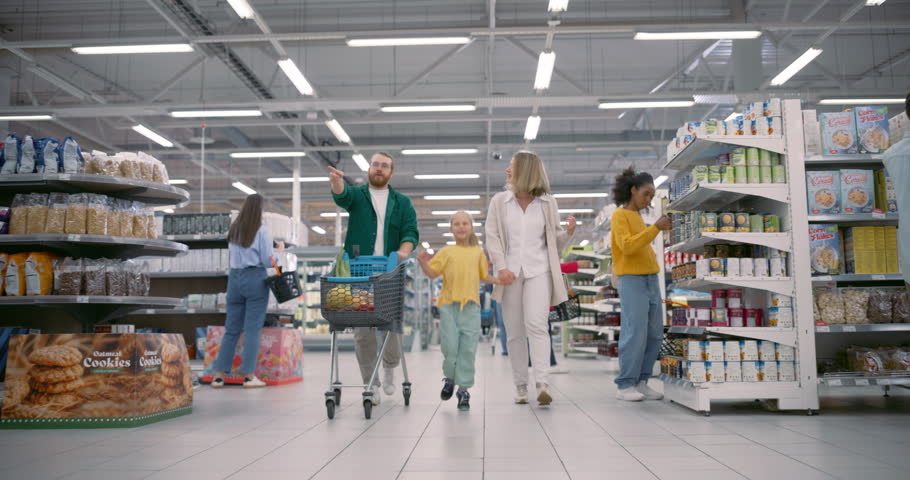 Diverse Male and Female Shoppers, Including Families and Individuals, Navigate Supermarket Aisles. People Selecting Groceries, Shopping for Offers. Shelves are Stocked with Various Healthy Products