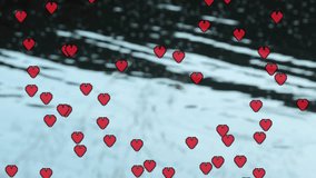 Animating red heart icons over snowy landscape with falling snowflakes. Animation, love, winter, holiday, romance, festive - Powered by Shutterstock - Get 15% off with code: PIKWIZARD15