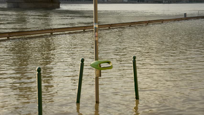 Budapest, Hungary - September 18, 2024: A Submerged Trash Bin in Flooded Budapest as the Danube Rises After Storm 