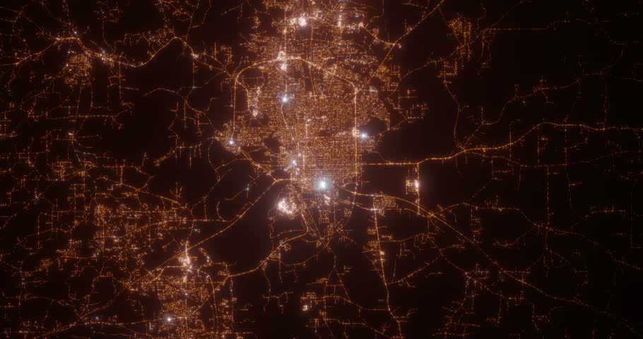 Montgomery (Alabama, USA) top view at night. Aerial view on modern city from space. Camera is flying above the city, moving forward. Vertical video. The north is on the left side