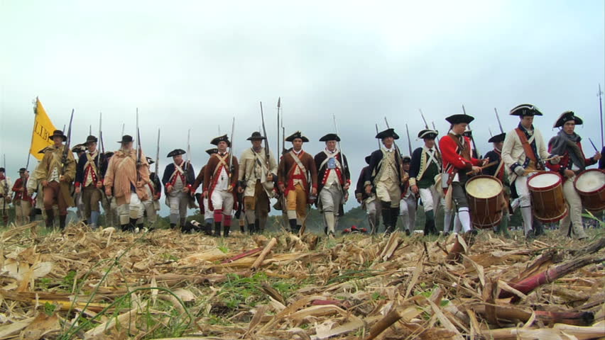 VIRGINIA - OCTOBER 2009 - large-scale, epic American Revolutionary War anniversary reenactment -- in the middle of battle.  Continental Army in line of battle marches forward toward camera.