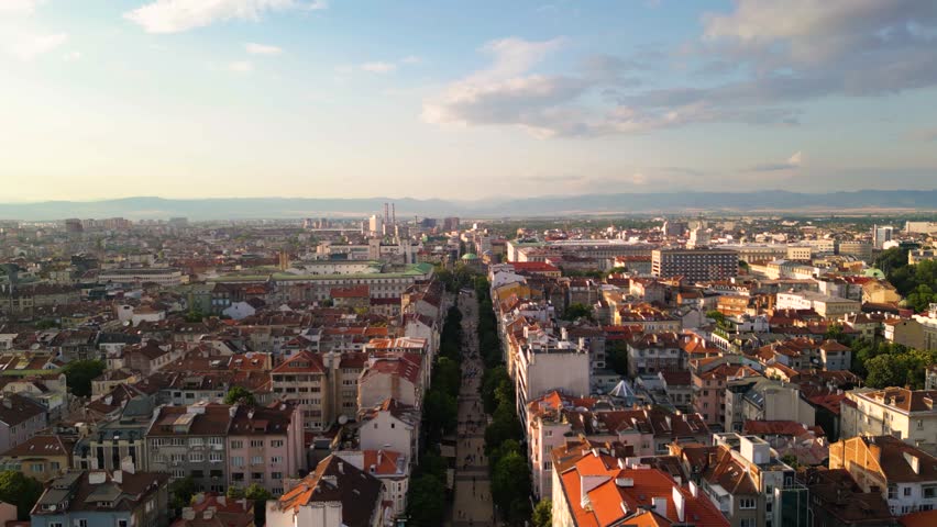 Aerial footage of the city center of Sofia Bulgaria. Main pedestrian street, City Court, National Palace of Culture, Vitoshka boulevard. Sunny view golden hour of european capital architecture.