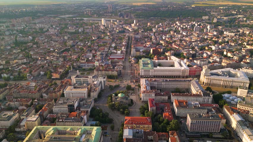 Aerial footage of the city center of Sofia Bulgaria. Main pedestrian street, City Court, National Palace of Culture, Vitoshka boulevard. Sunny view golden hour of european capital architecture.