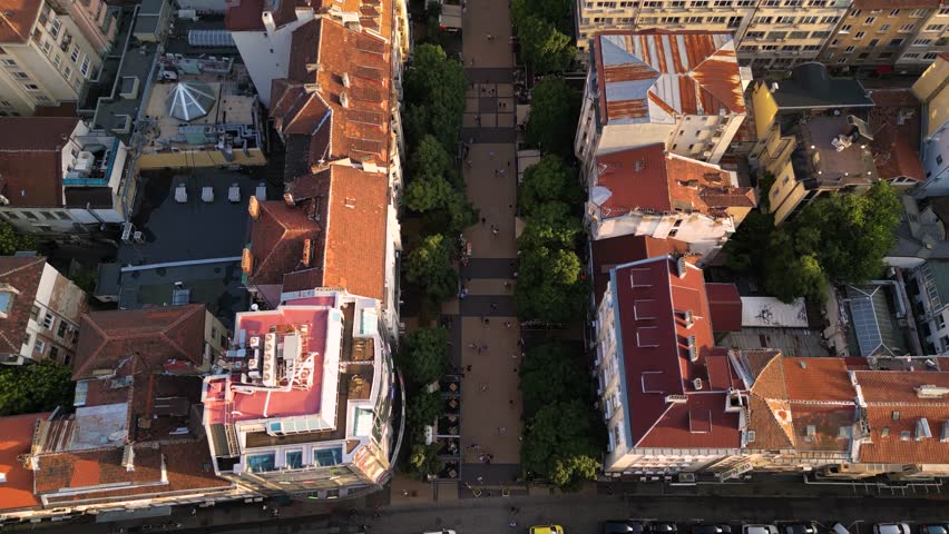 Aerial footage of the city center of Sofia Bulgaria. Main pedestrian street, City Court, National Palace of Culture, Vitoshka boulevard. Sunny view golden hour of european capital architecture.