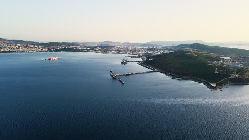 Crude oil and petroleum products terminal port for handling and vessel loading services oil products, Aerial view of pier and refinery