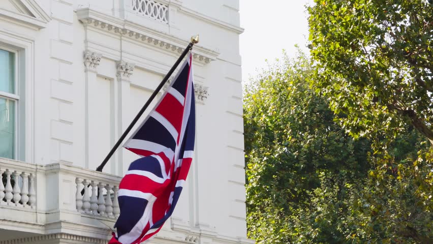  Large UK flag waving proudly on a building, symbolizing national pride and unity