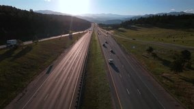 i70 interstate cars traffic trucks buffalo Evergreen aerial drone Idaho Springs summer sunlight sunset Golden Canyon Indian Peaks Genesse Park mountain layers Rocky Mountains Colorado USA forward - Powered by Shutterstock - Get 15% off with code: PIKWIZARD15