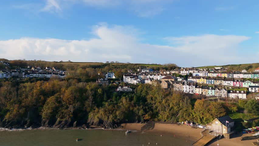 Charming bright coloured houses clustered on the hill overlooking tranquil bay