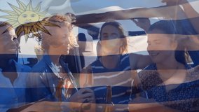 Friends enjoying drinks at beach with Uruguay flag animation in background. vacation, party, summer, celebration - Powered by Shutterstock - Get 15% off with code: PIKWIZARD15
