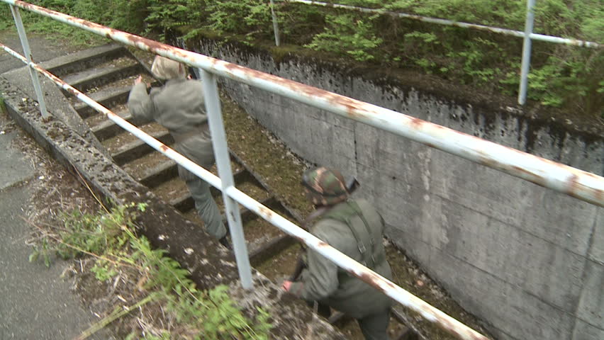 Soldiers running up stairs from bunker - slow motion