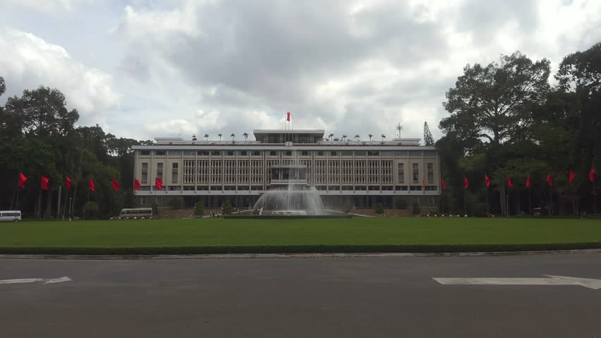 Large government building surrounded with trees. Independence Palace also known as the Reunification Convention Hall. Ho Chi Minh City, Vietnam.