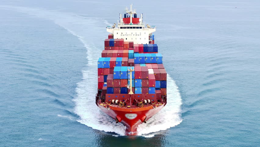 Cargo container ship carrying container and running out international container port customs shipyard sea port concept smart logistic service. Portrait video Container Ship.	