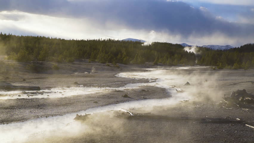 Cinematic shot of scenic landscape at steaming river in Yellowstone National Park, USA
