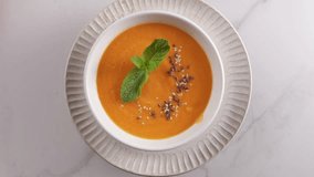 rotation autumn vegan pumpkin cream soup in white bowl on light table food - Powered by Shutterstock - Get 15% off with code: PIKWIZARD15