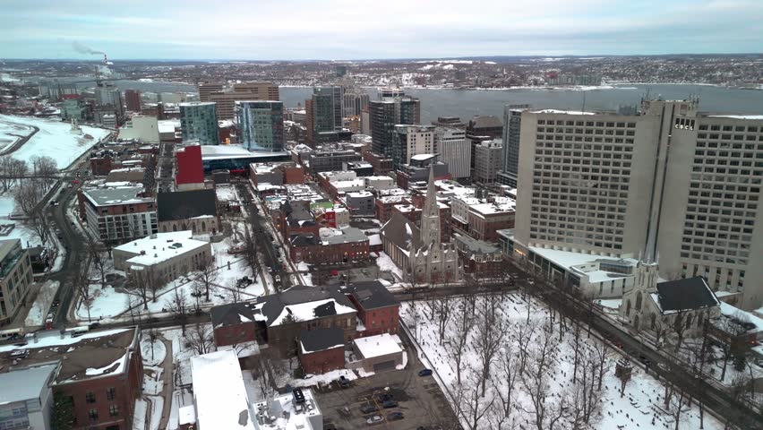 A Winter Wonderland In Halifax As Seen From Above, With Snow-Covered Rooftops And Icy Roads Reflecting The City Cold, Snowy Weather. An Aerial View Of Halifax In The Heart Of Winter, Featuring Snow