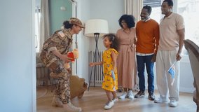Cinematic video of a woman coming back home from the army military service in the us. Family reunited at lunch time indoor in a beautiful american house. - Powered by Shutterstock - Get 15% off with code: PIKWIZARD15